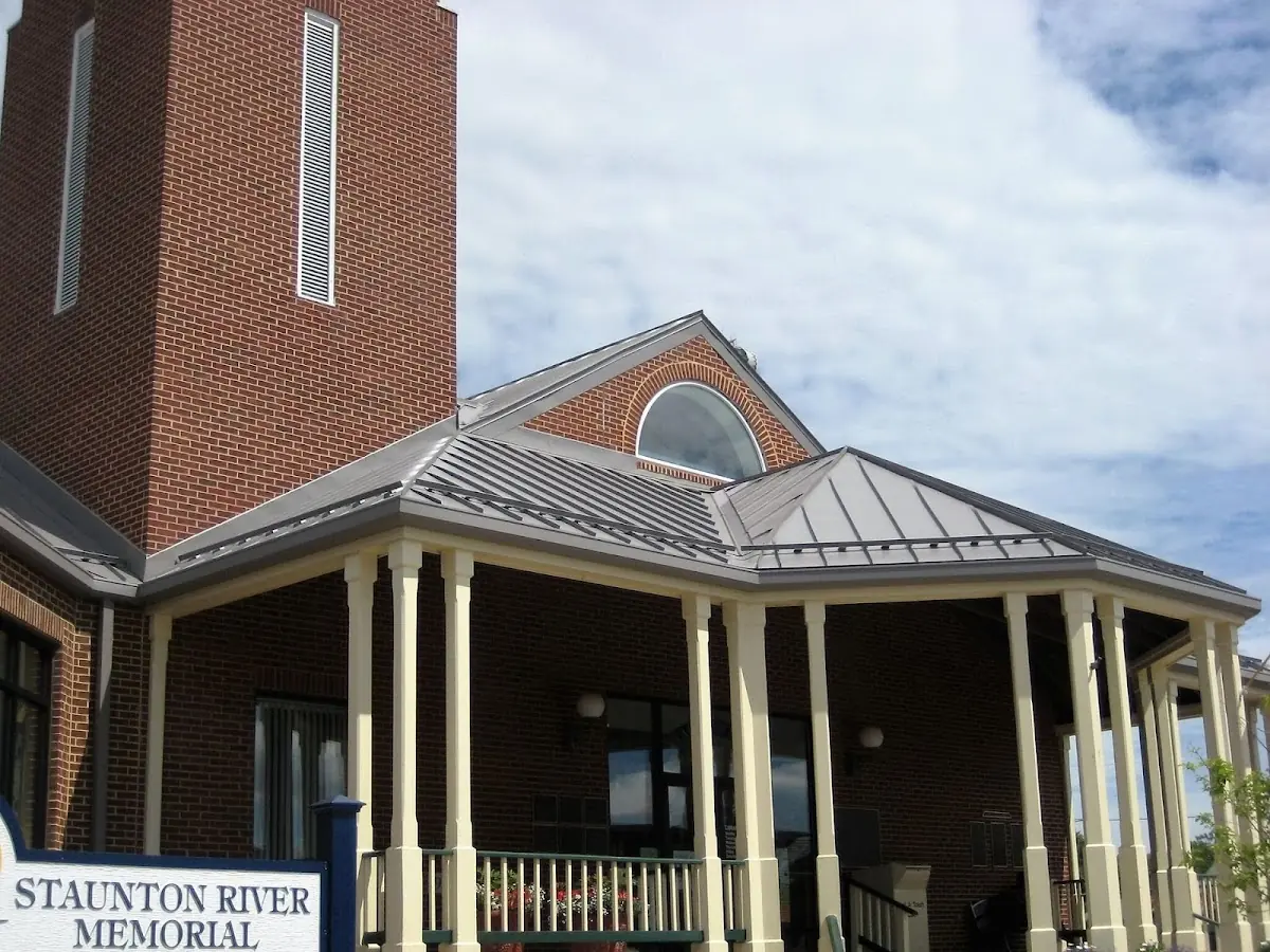 Skilled roofing craftsmen working on a residential roof in Canton